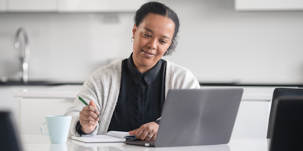 Woman studying with laptop