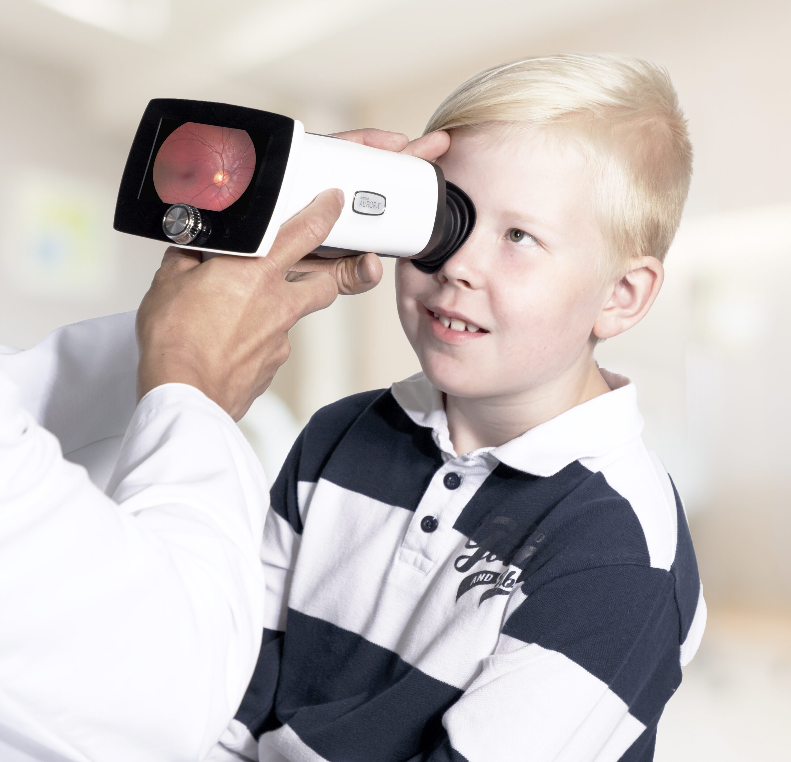 Taking a fundus image with handheld fundus camera of a pediatric patient